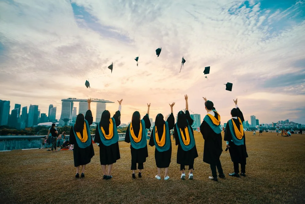 Graduates celebrating with raised caps
